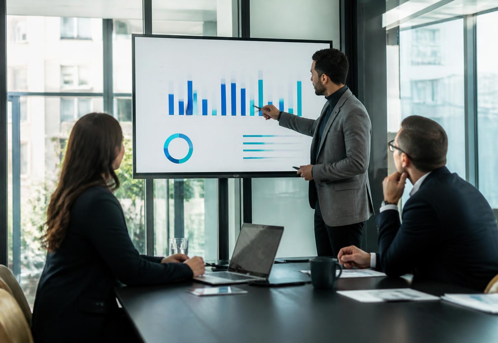 A recruitment leader and the HireScope team reviewing recruitment advertising performance data together